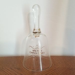 Christmas bell. Clear. Clapper is missing.